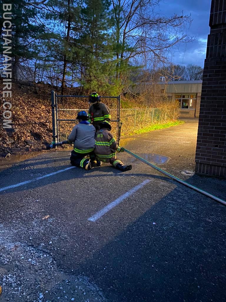 Members practicing hose line advancement 