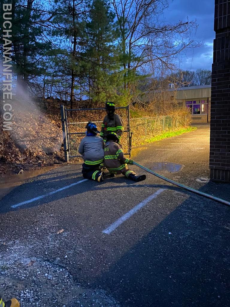 Members practicing hose line advancement 