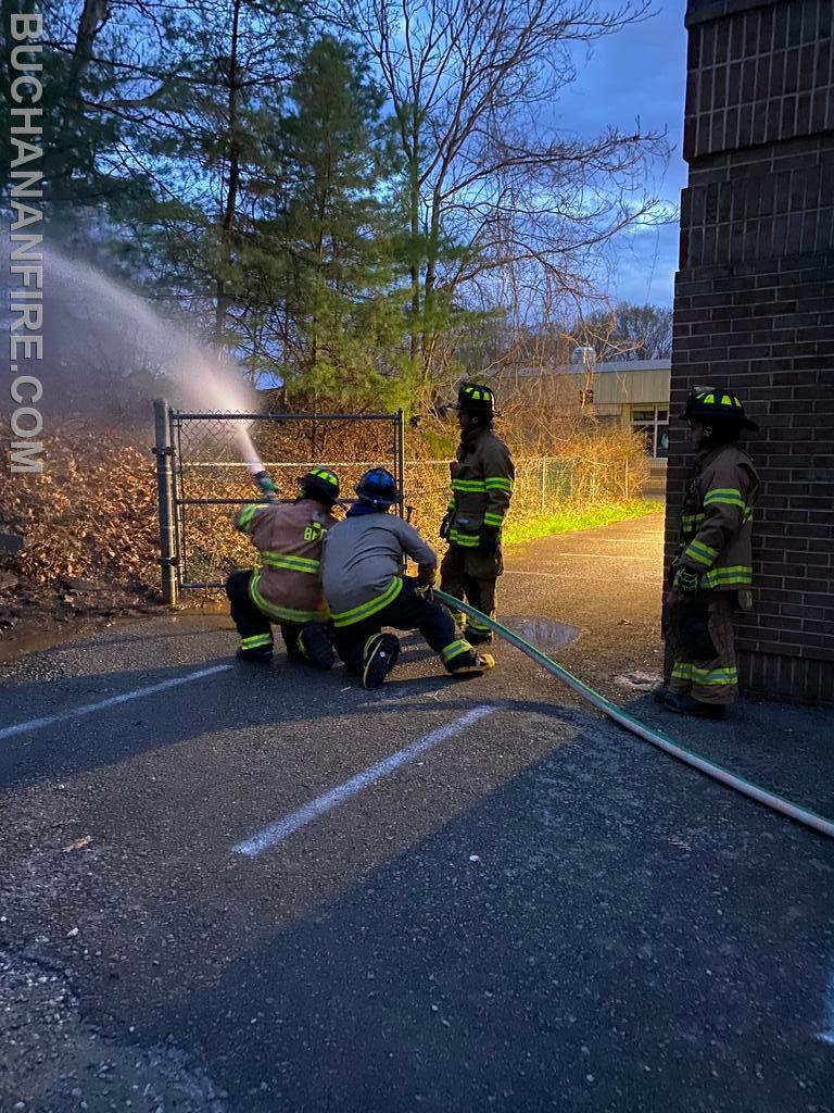 Members practicing hose line advancement 